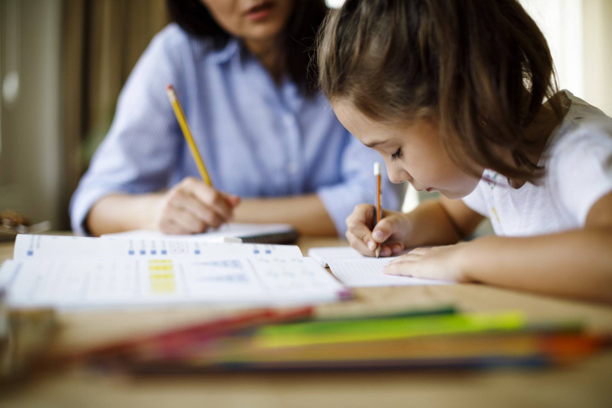 Mother helping daughter with homework The Best Back to School Shopping Deals in Grapevine at Park Place