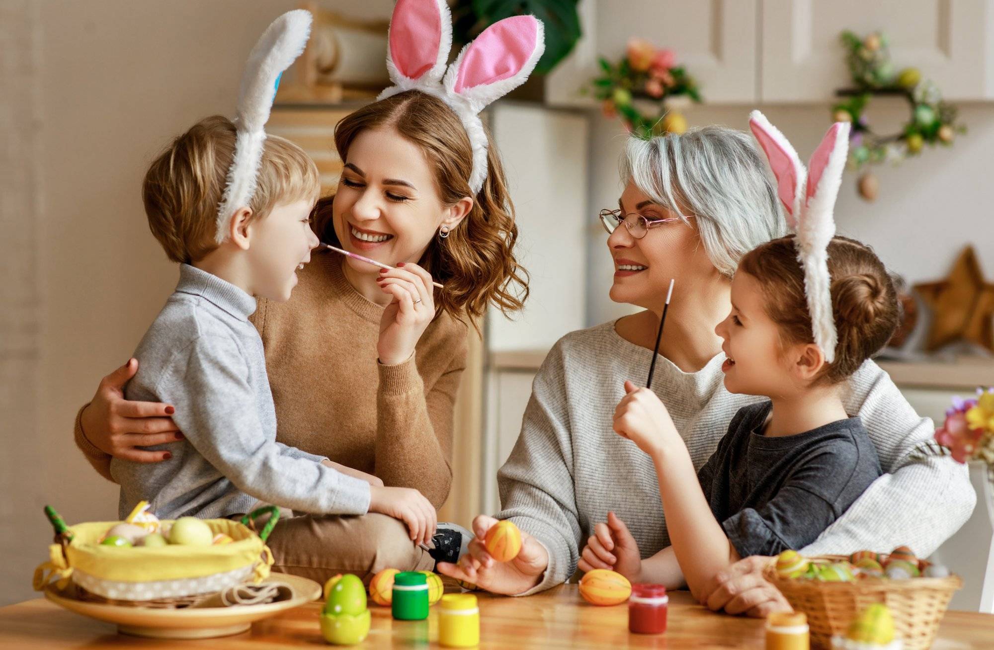 Happy easter! family mother, grandmother and children paint eggs for holiday Celebrate Spring in Grapevine with the latest Easter 2021 Celebration Ideas From Park Place