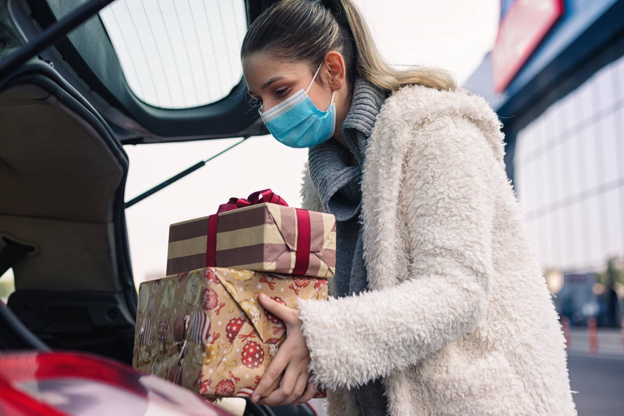 Teenage girl wears a protective mask while shopping for Christmas during COVID-19 pandemic Holiday Party Ideas to Celebrate the Season from Park Place