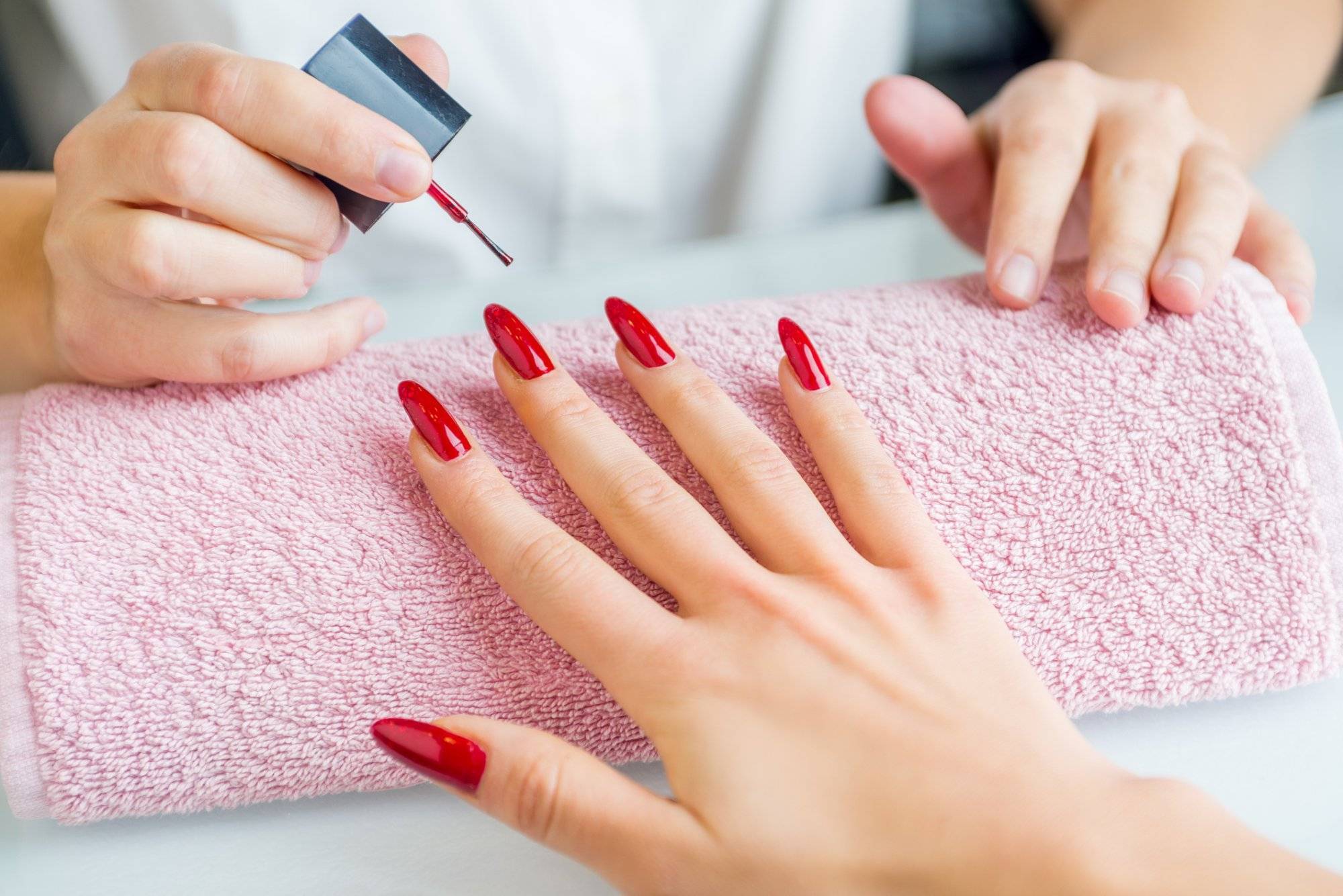 A woman with red painted nails getting a manicure Treat Yourself to a Valentine's Day Spa Day in Grapevine at Park Place